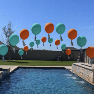helium balloon arches over pools